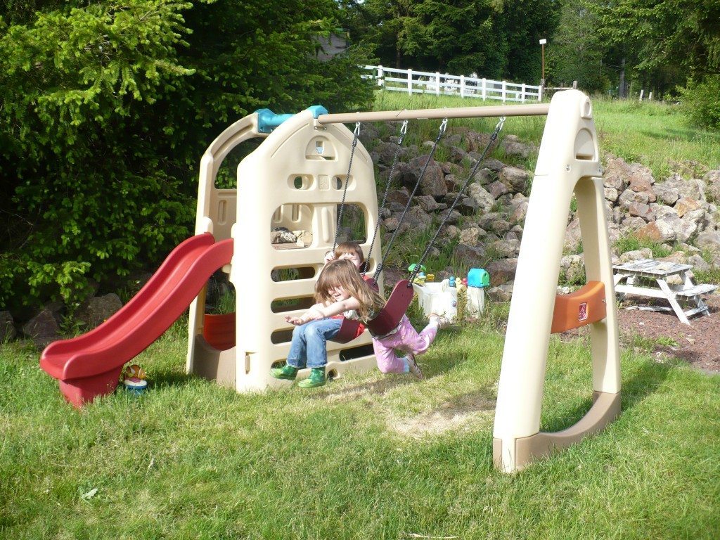 step2 naturally playful playhouse with slide & swing