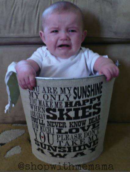 crying baby in bucket