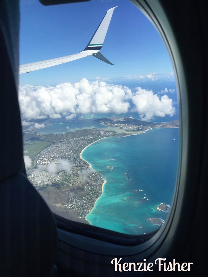 looking out an airplane window at Hawaii