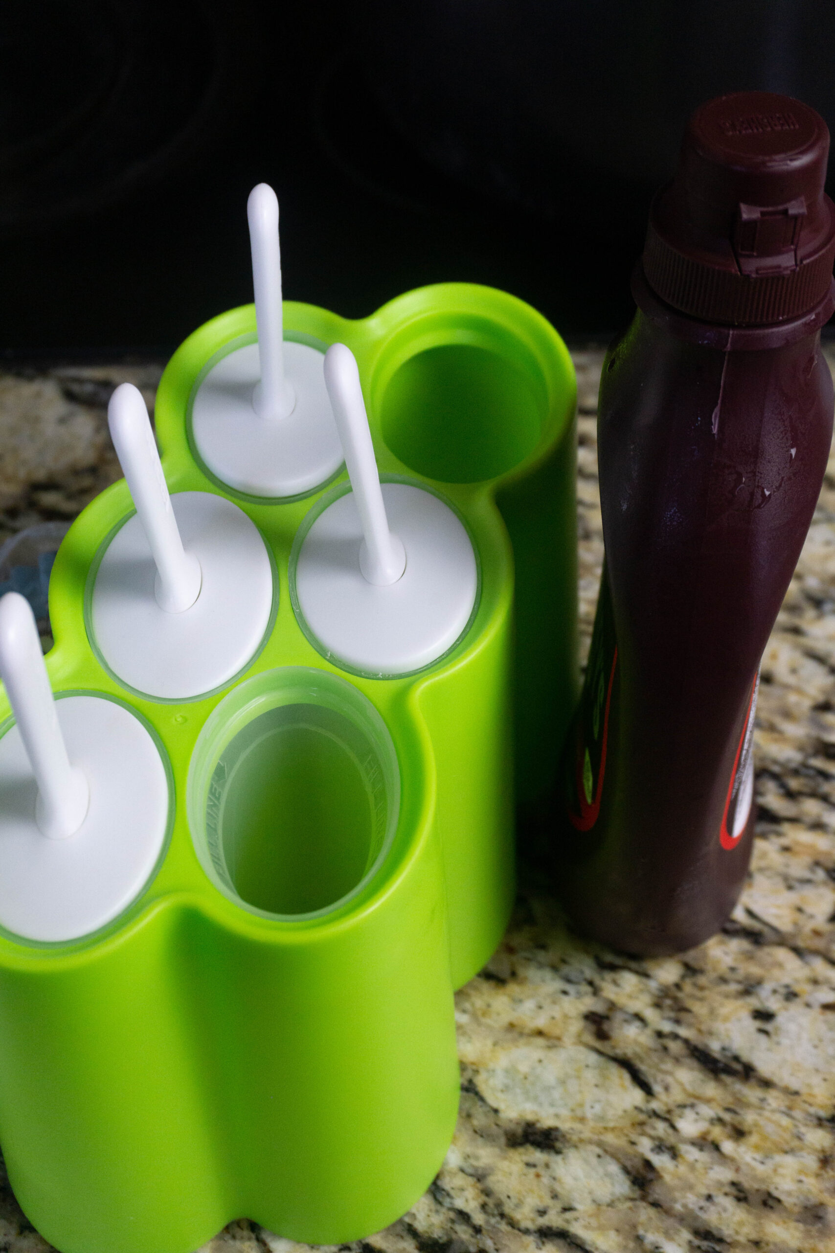 popsicle mold and chocolate syrup
