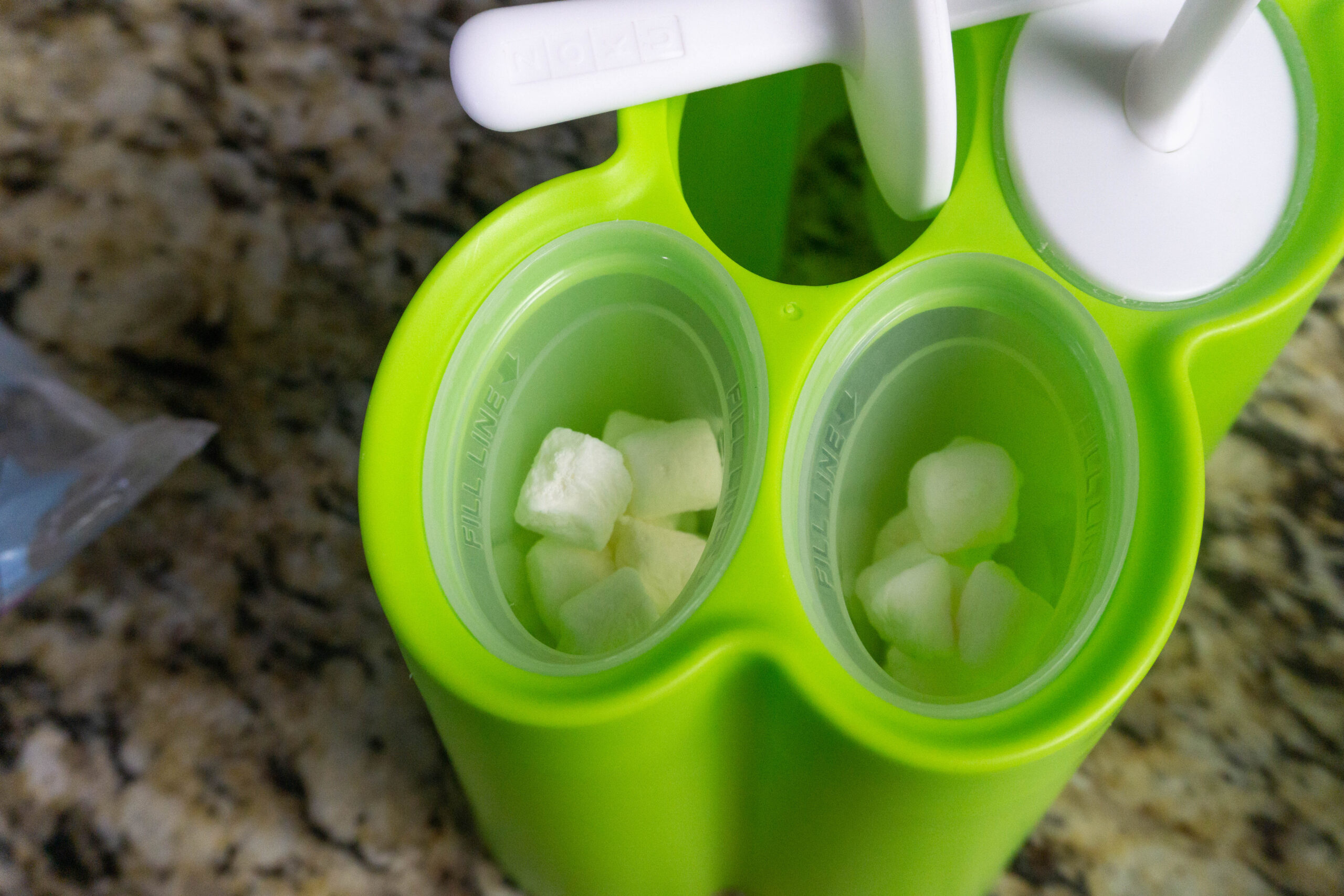 mini marshmallows in popsicle mold