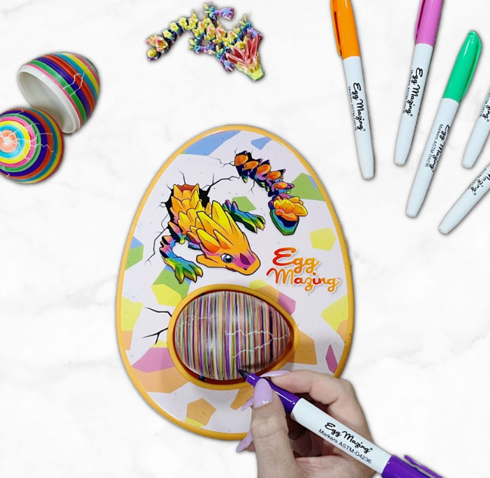 Dragon EggMazing Egg Decorator (Hey Buddy Hey Pal | Ages 3+ | MSRP $27.99 | Available September on Amazon): This new, non-seasonal decorator is the perfect indoor activity and a great TV visual! This decorating kit allows you to create your own vibrant dragon eggs. Place one of the two included eggs into the machine and watch it spin as you use the colorful markers to “egg-pose” your egg’s cracks! When you’re done decorating, open your egg to reveal your collectible 3D printed dragons!