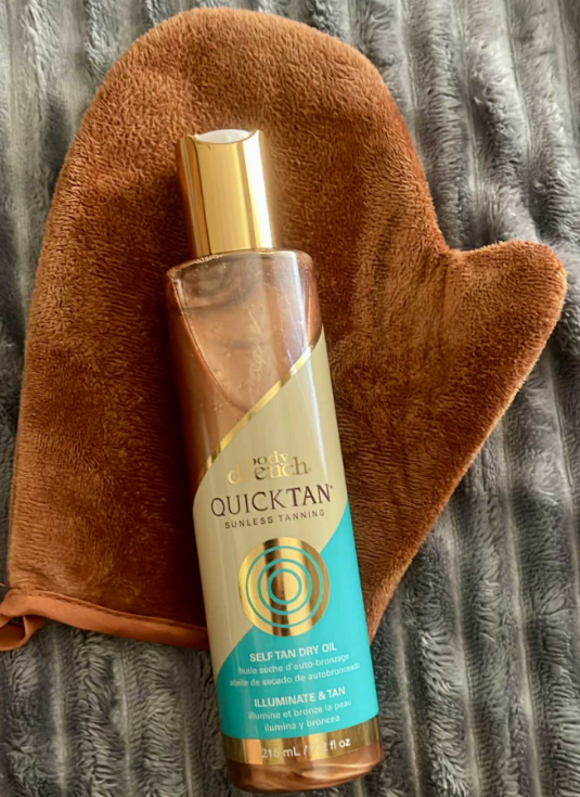 Body Drench Quick Tan Self Tanner Dry Oil – Sunless Tanning Oil for Glowing Skin, Streak-Free Bronzer with Natural-Looking Tan in Hours, 7.2 oz. Gives me a gorgeous sunless tan that has a bit of shimmer to it! I love how it smells and how healthy and tan it makes me look! Definitely recommend this!